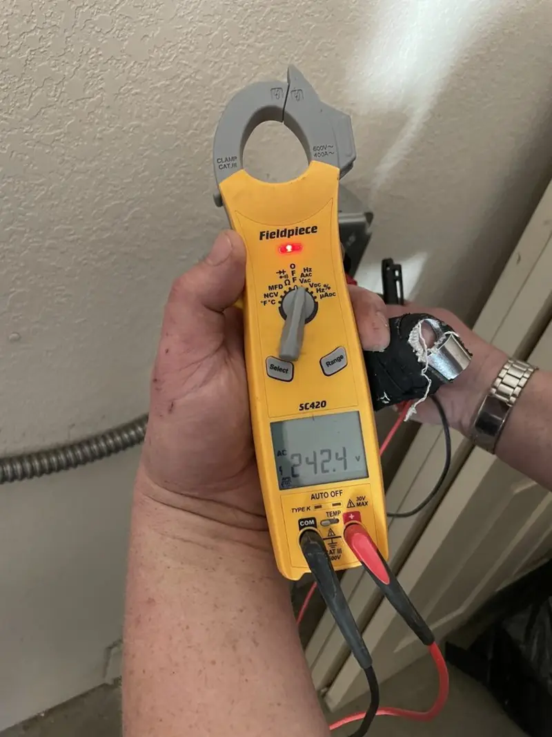 Voltage testing with clamp meter during Aluminum Wiring Replacement in Chain Lake
